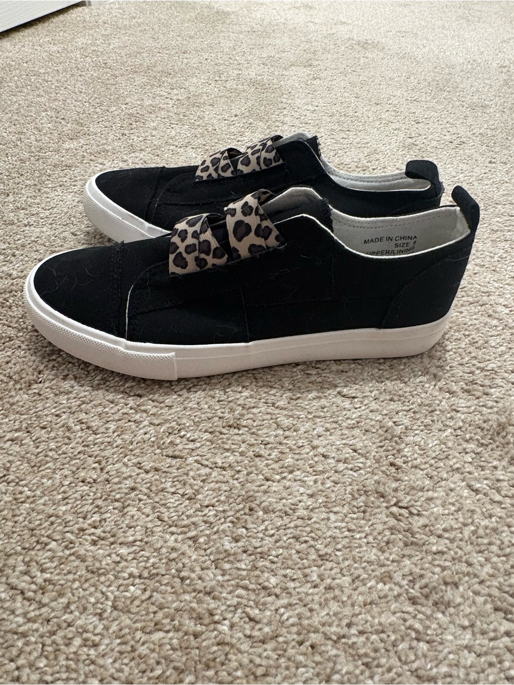 Black Slip-On Sneakers with Leopard Bow